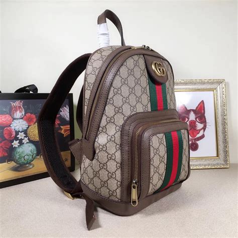 a gucci backpack with diamonds on it